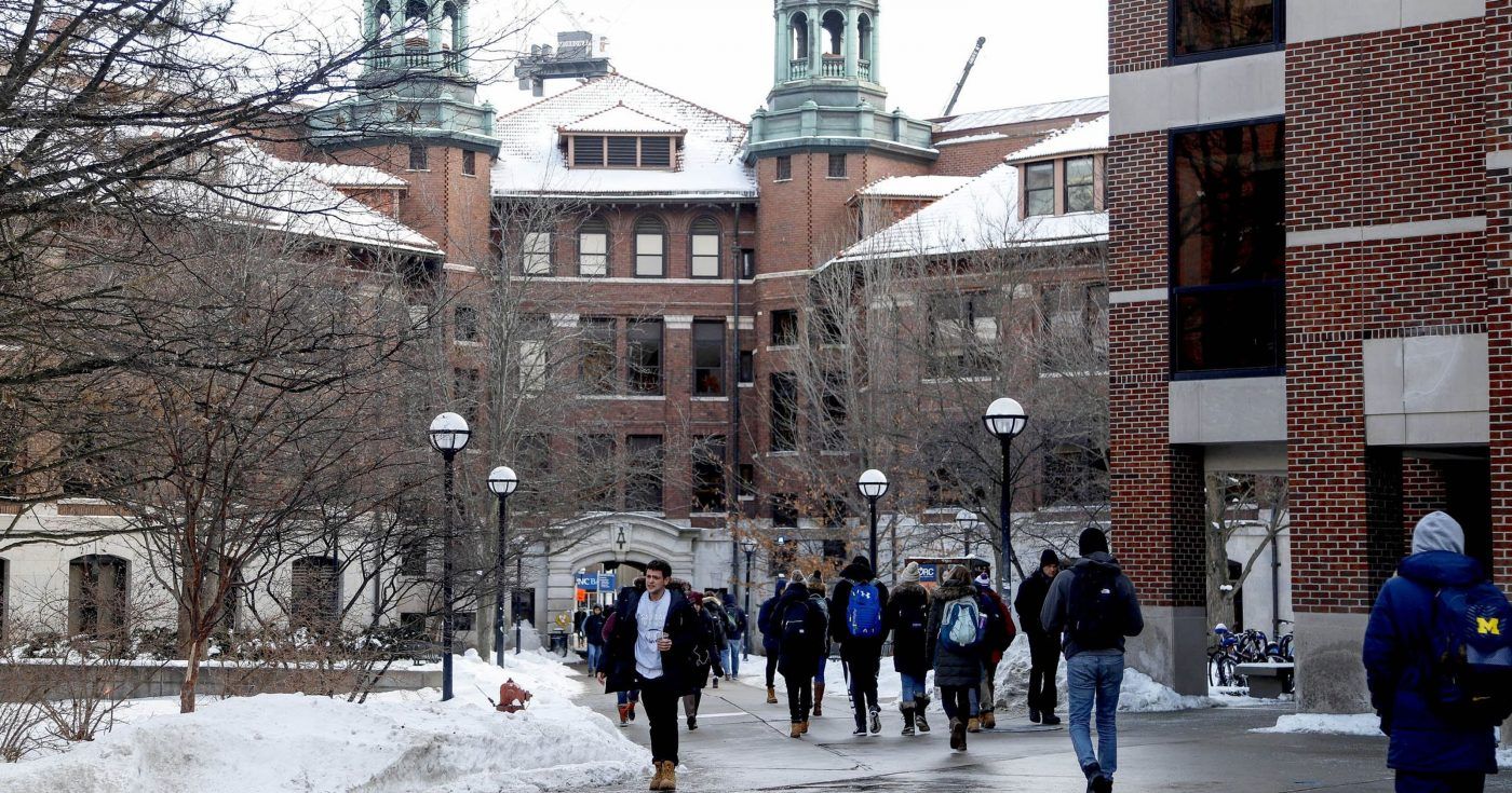 Students walking on the Diag in the winter