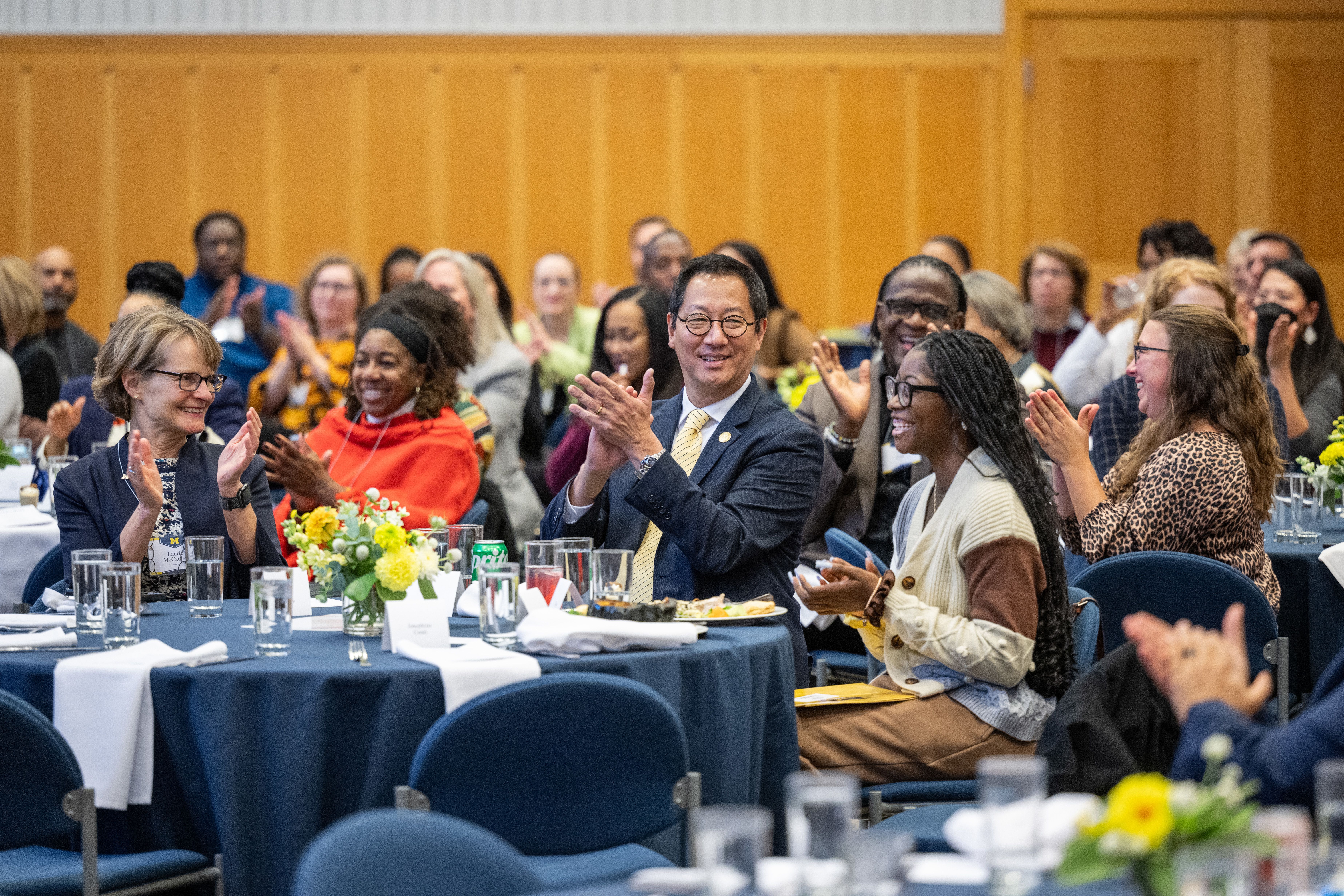 President Ono and Provost McCauley applauding while attending the DEI Leads luncheon