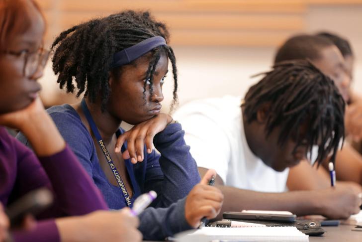 Students taking notes in class