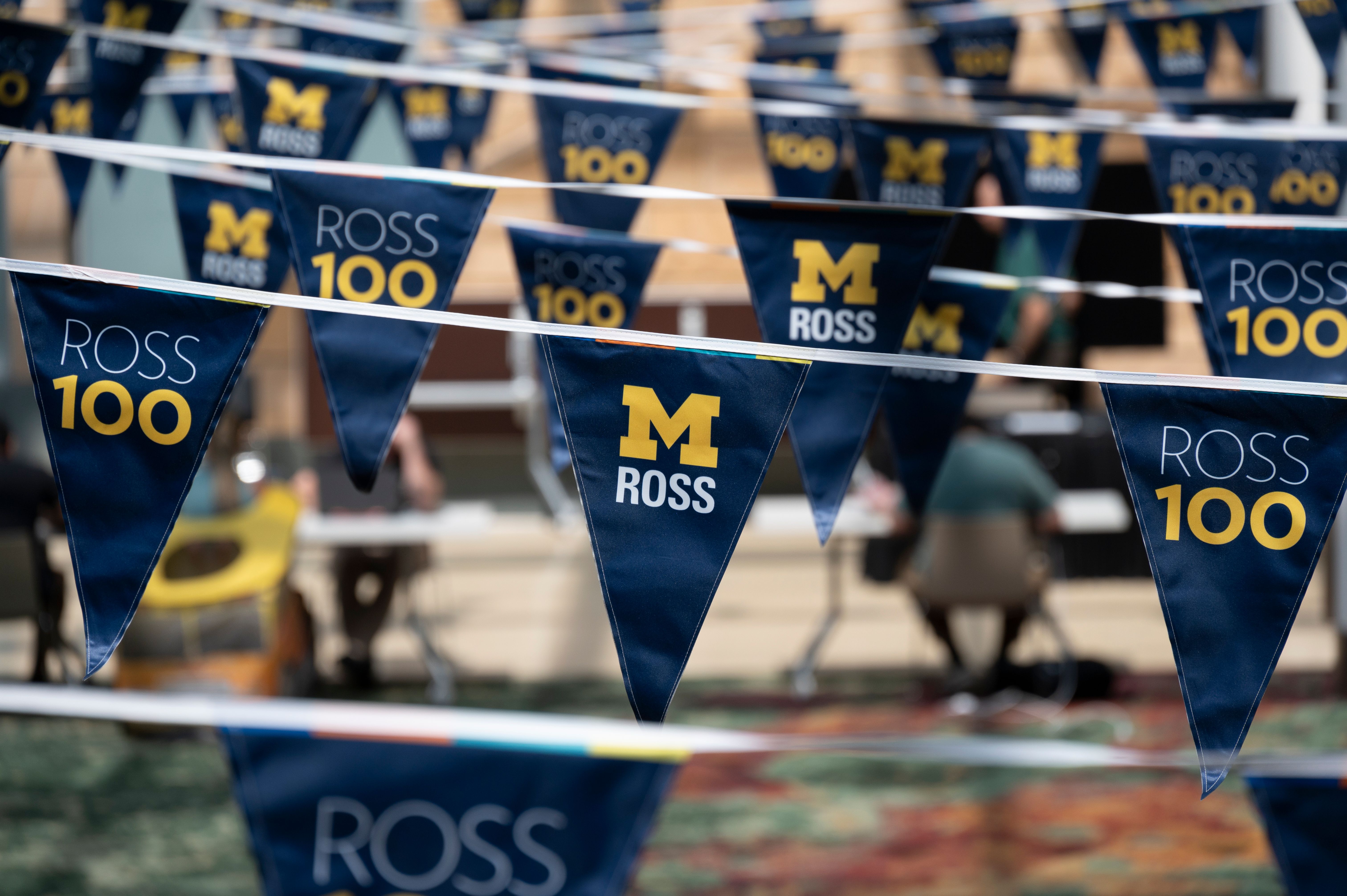 Strings of pennants that say M Ross and Ross 100