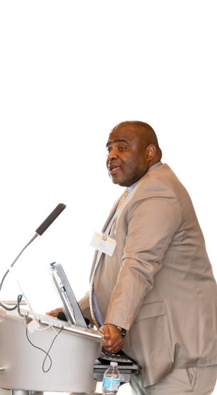 Rob Sellers speaking at a lectern