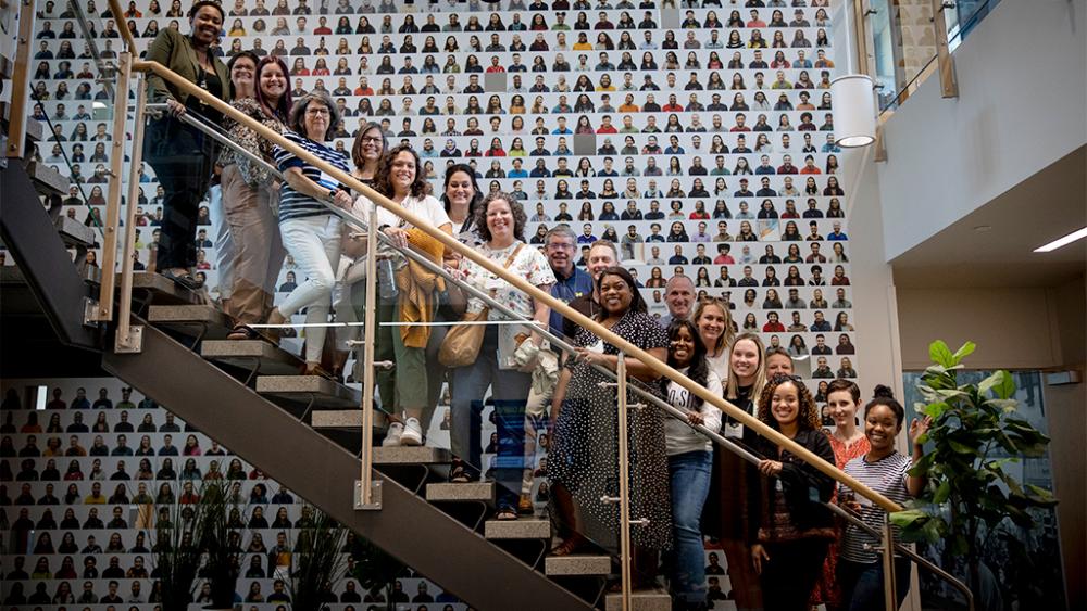 People posing on the stairs inside of the Trotter Multicultural Center