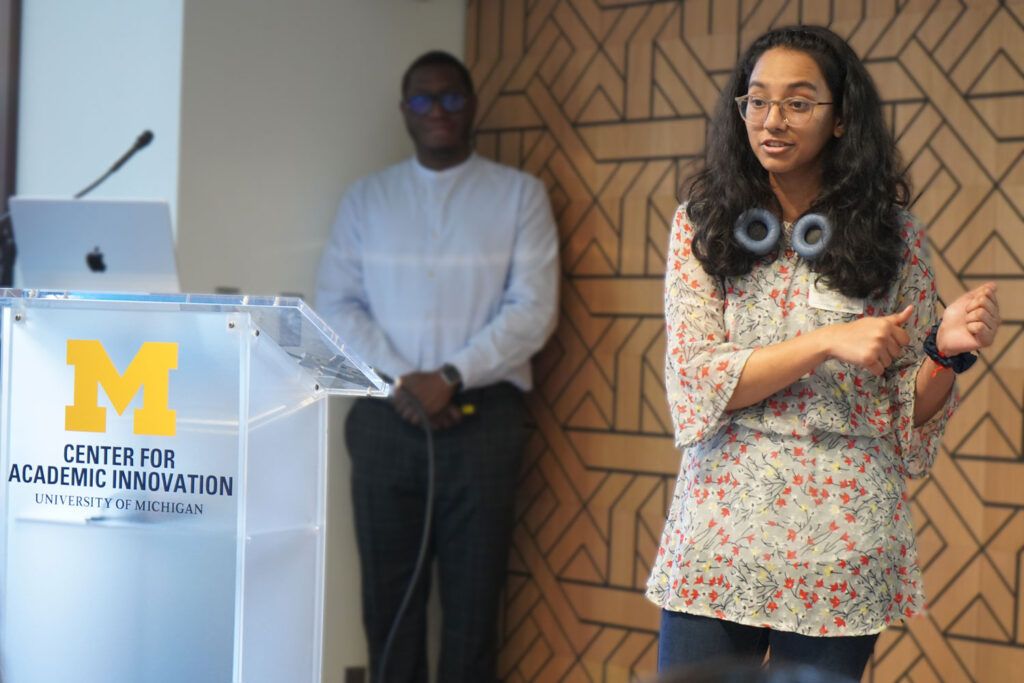 A person speaking at a Center for Academic Innovation presentation