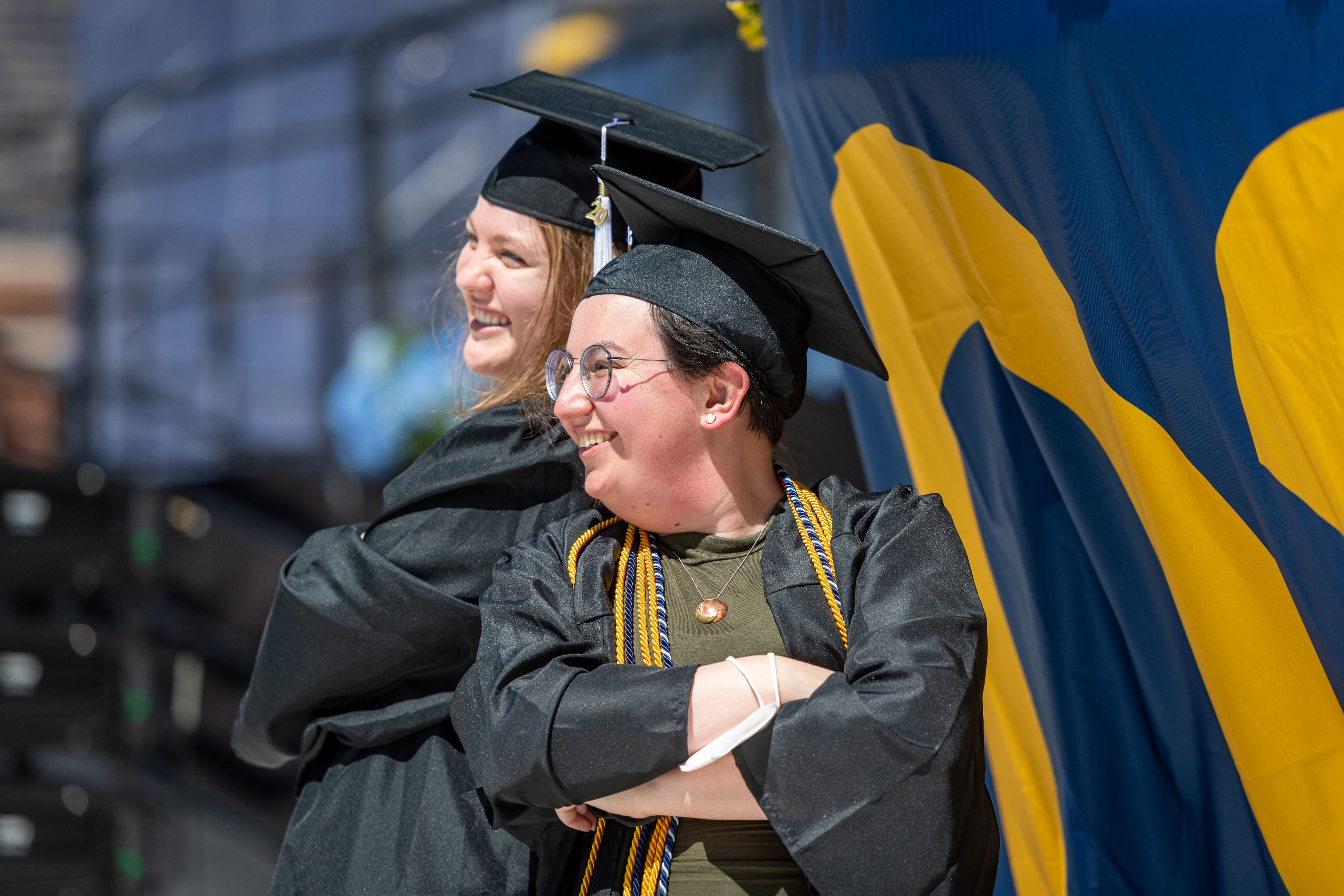 Graduates posing back to back