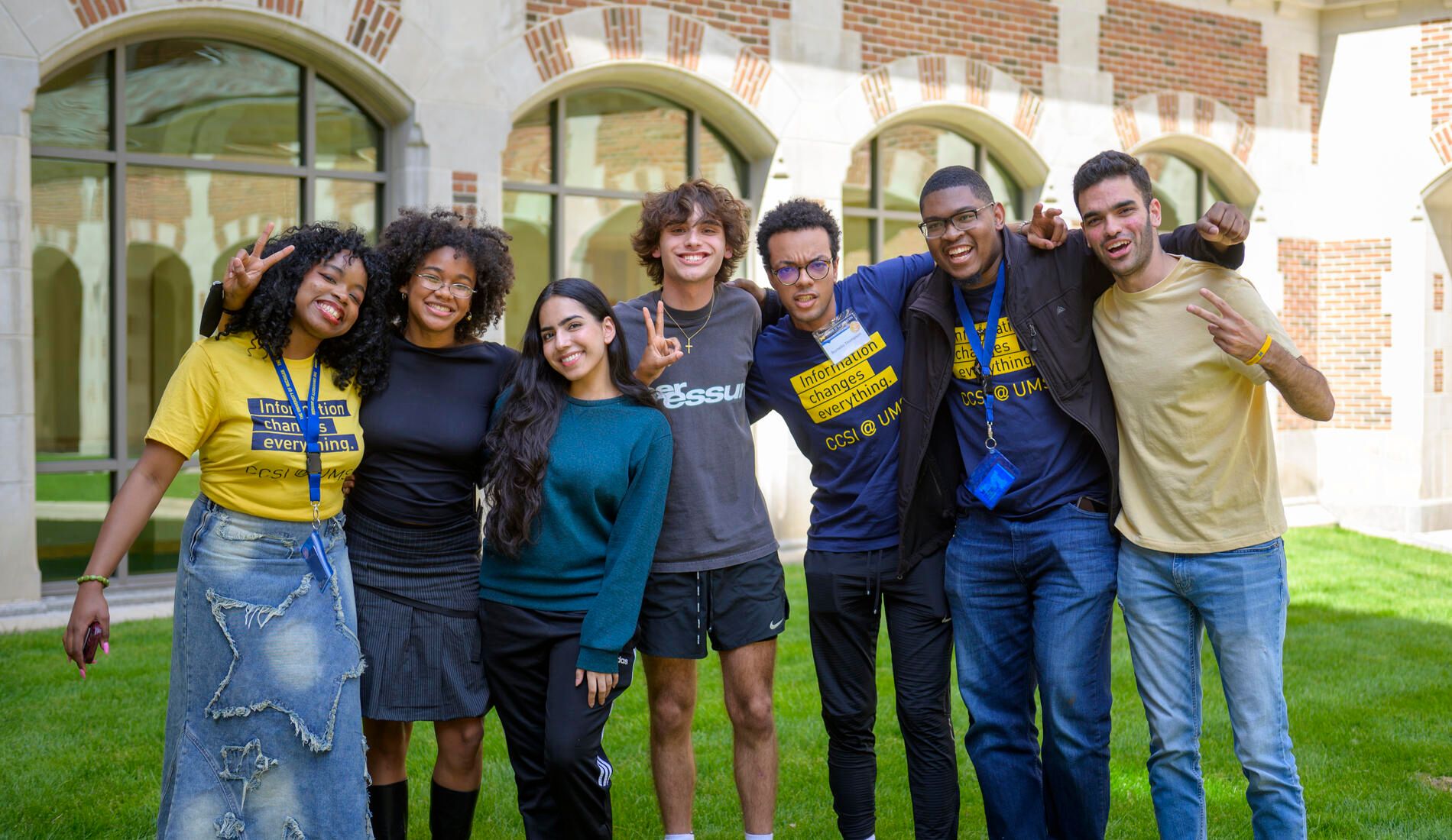 People standing with their arms around each other outside of North Quad