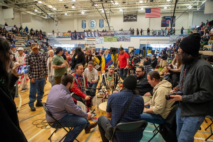 People playing drums at the powwow event